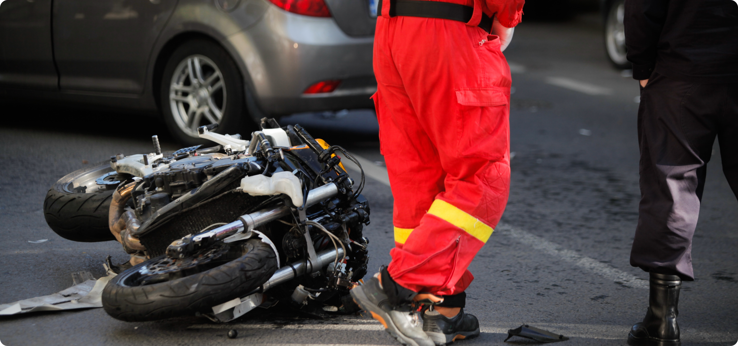 Image of experienced motorcycle accident lawyer in NYC; Image of a personal injury attorney discussing case with client; Infographic of the motorcycle accident claim process