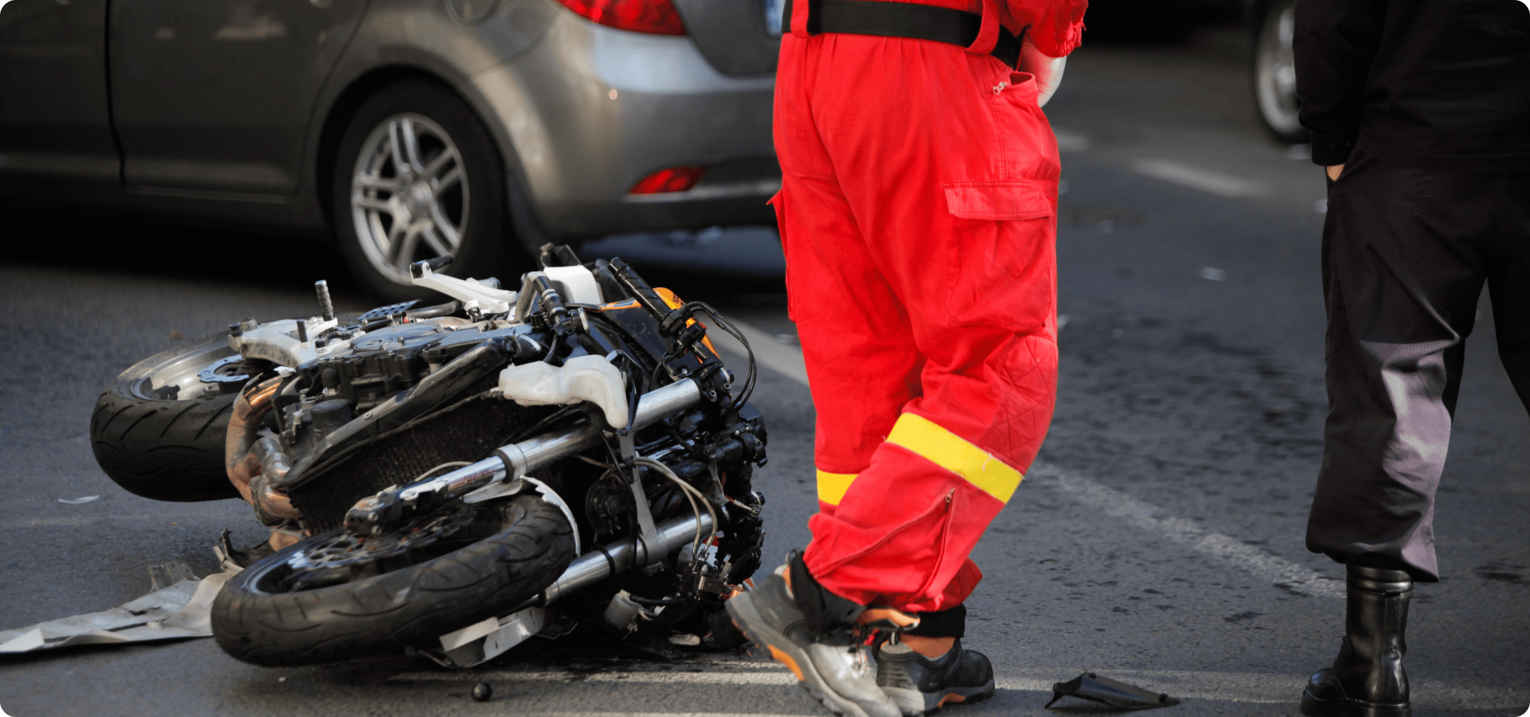 Image of experienced motorcycle accident lawyer in NYC; Image of a personal injury attorney discussing case with client; Infographic of the motorcycle accident claim process